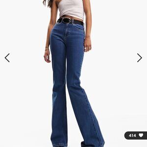 ASOS DESIGN mid rise flare jeans in mid blue